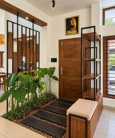 Foyer with a teak door, steel-and-timber screen and indoor planting