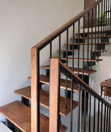 Teak and black steel staircase inside GPT Residence