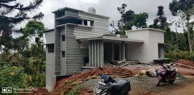 Valley Twin House nearing completion with grey cladding installed